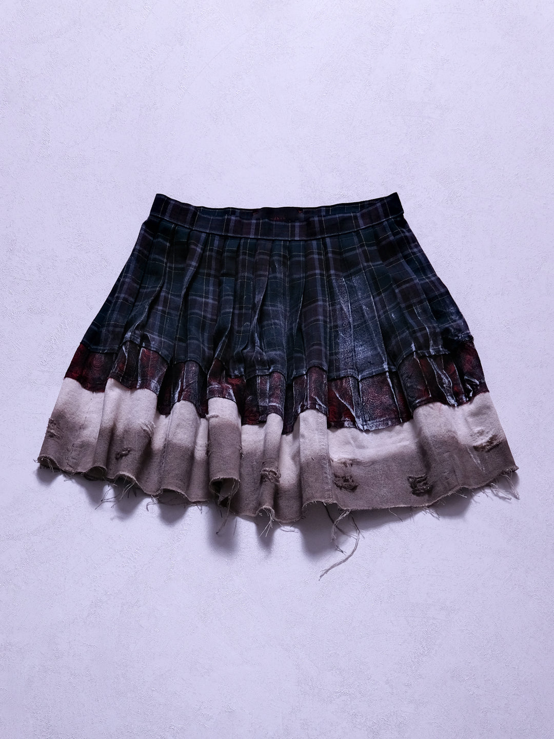 One-of-one upcycled mini skirt, front product shot with multi-layered silhouette and gradient effect
