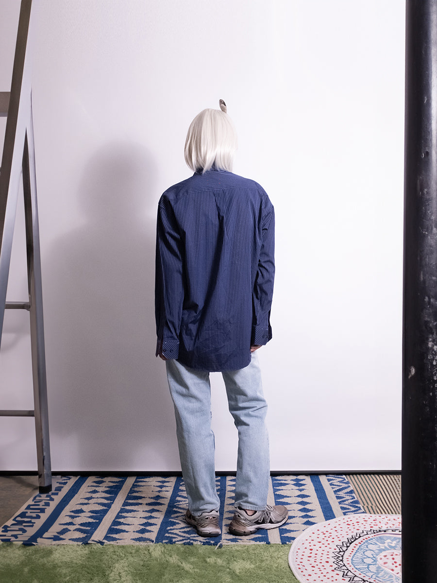 Back view of vintage reworked striped shirt detailed with distressed finish